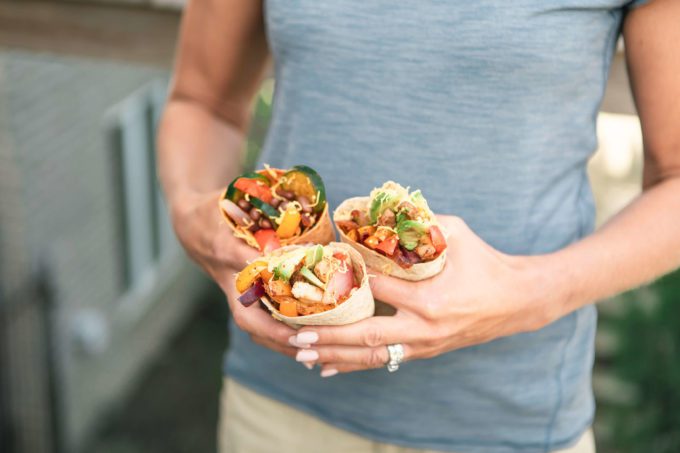 Mom holding 3 fajitas