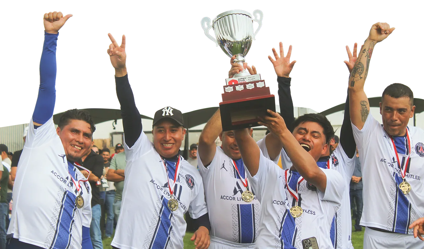 Nature Fresh Farms team members celebrating with a trophy
